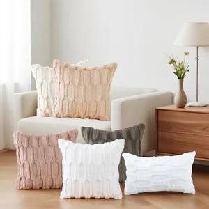 Plush quilted embroidered cushion covers set in minimalist living room