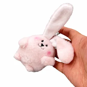 Adorable pink plush bunny keychain doll with floppy ears and cute facial features
