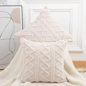 Close-up of cream plush quilted pillow cover with geometric cable-knit texture for sofa decor
