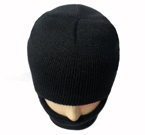 Detailed close-up showing the ribbed texture of a black knitted winter beanie for men