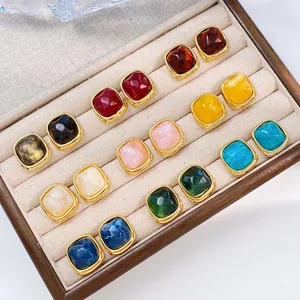 Collection of colorful square sugar-cube stainless steel stud earrings in display box