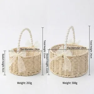 Handmade woven rattan flower basket with elegant pearl handle and ribbon bow decoration