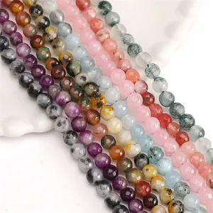 Macro detail view of colorful faceted natural stone round beads for DIY jewelry
