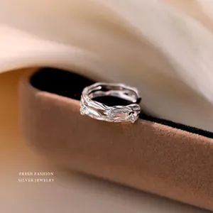 Macro detail of a silver ring with a textured, glittering star-like surface