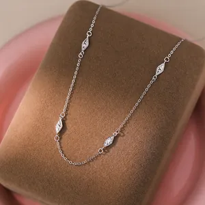 Close-up detail of S925 silver shimmering necklace with diamond-shaped zircon stone accents