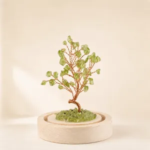 Handmade green natural crystal stone tree with twisted copper wire on round wooden base