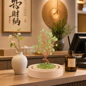 Detail of a green crystal money tree with copper wire on a wooden base for home decor