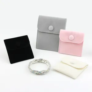 Set of premium colorful velvet jewelry pouches with snap buttons for accessory storage