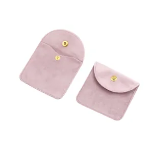 Pair of premium pink velvet jewelry pouches with gold snap buttons on a clean white background