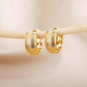 Luxury 18K gold plated hoop earrings featuring a granular textured surface design