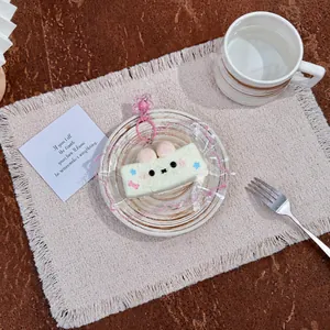 Cute rabbit-shaped silicone squishy toy for stress relief on a decorative plate
