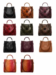 Collection of embossed faux leather tote bags in various colors and textures