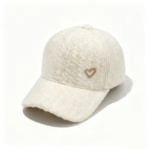Detail showing the soft fuzzy texture and rhinestone heart on a white baseball cap