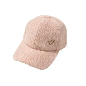 Warm and stylish pink fuzzy alpaca fleece baseball cap featuring a rhinestone heart