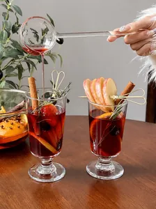 Detailed macro view of glass goblets filled with festive mulled wine and spices