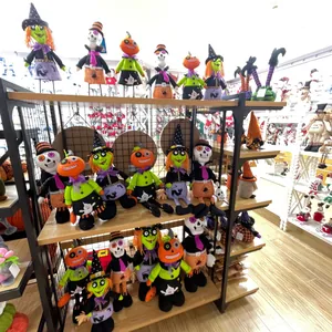 Assorted Halloween plush dolls including witches and pumpkins displayed on retail shelves
