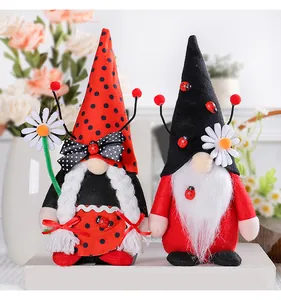 Detailed close-up of ladybug-themed gnome plush dolls featuring polka dot hats and flowers.
