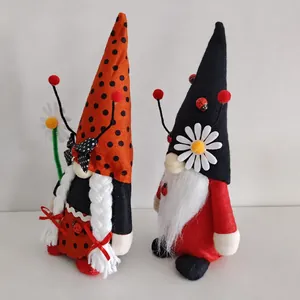 Side profile detail of two creative ladybug themed plush gnomes for holiday decor