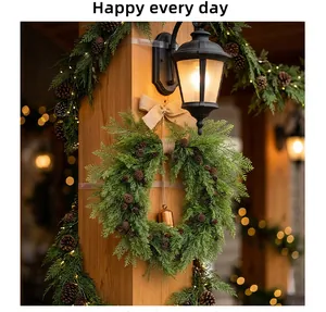 Close-up of heart-shaped Christmas wreath with cedar branches, pine cones and bell