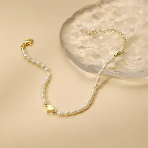 Minimalist golden heart charm necklace with elegant irregular white freshwater pearls