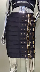 Close-up of a sexy black bandage skirt featuring decorative gold belt buckles and eyelets