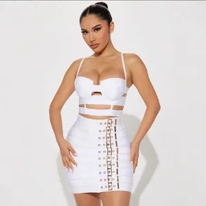 Stylish white two-piece bandage set featuring a sexy crop top and buckle mini skirt