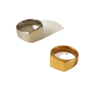 Pair of minimalist stainless steel square signet rings in polished gold and silver finishes