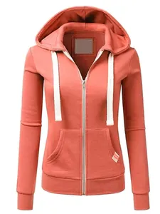 Detailed view of a coral pink women's zip-up hoodie featuring white drawstring accents