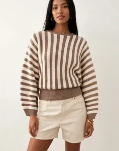 Close-up detail of a vintage-style brown and white striped knitted crewneck sweater