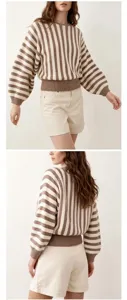 Detail view of retro brown striped knit sweater with lantern sleeves and ribbed hem