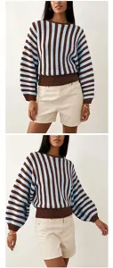 Detail view of a classic retro striped knit sweater with ribbed crew neck and loose fit