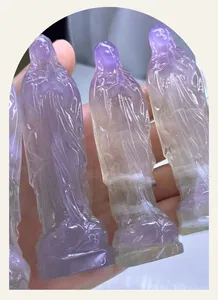 Detailed view of translucent natural purple fluorite Virgin Mary crystal carving statue