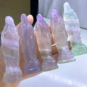 Hand-carved natural fluorite crystal Virgin Mary figurines in pastel purple and green shades.