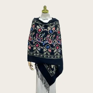 Elegant black cashmere-like shawl featuring intricate floral paisley embroidery and tassels