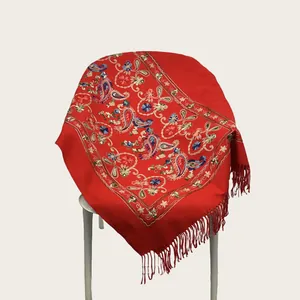 Elegant red embroidered shawl with paisley floral patterns and tassels in imitation cashmere