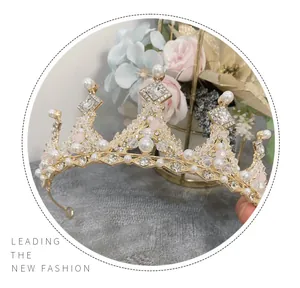 Detailed macro view of children's golden princess crown with pearls and rhinestones