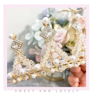 Close-up of elegant princess crown with sparkling rhinestones and delicate pearls