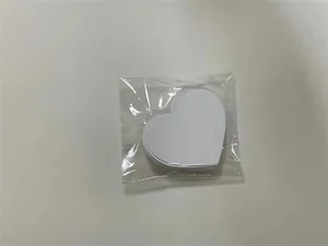 Close-up detail of 50 heart-shaped white thank you cards in transparent plastic packaging