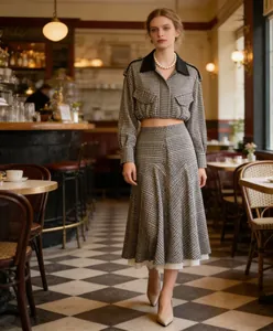 Full view of retro plaid pilot jacket and matching midi skirt set in cafe setting