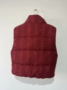 Back view of burgundy cable-knit quilted vest showing horizontal stitching details