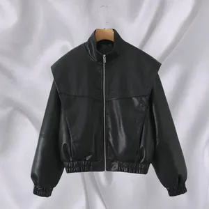 Close-up of black faux leather bomber jacket featuring wide shoulders and zip front