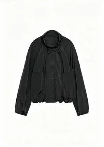 Close-up detail showing the pleated texture and nylon material of this black jacket.