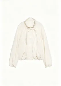 Detailed view of women's pleated nylon jacket with high stand collar in cream white