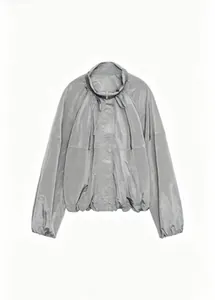 Close-up of lightweight metallic grey stand-collar nylon jacket with pleated texture.