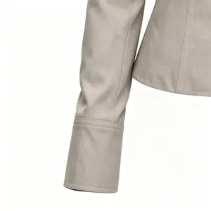 Detailed view of gray faux suede Napoleon jacket sleeve and stitching craftsmanship