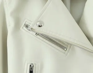 Close-up of premium cream white PU leather motorcycle jacket featuring silver metal zipper