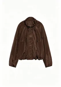 Detail of dark brown long-sleeve nylon jacket with stand collar and ruched design.