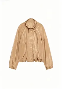 Detail view of a stylish champagne nylon jacket with stand collar and pleat accents.