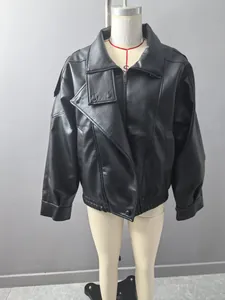 Detailed view of a stylish black oversized faux leather jacket displayed on a mannequin