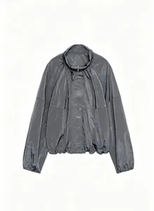 Trendy women's pleated nylon jacket in metallic grey with stand collar and long sleeves.